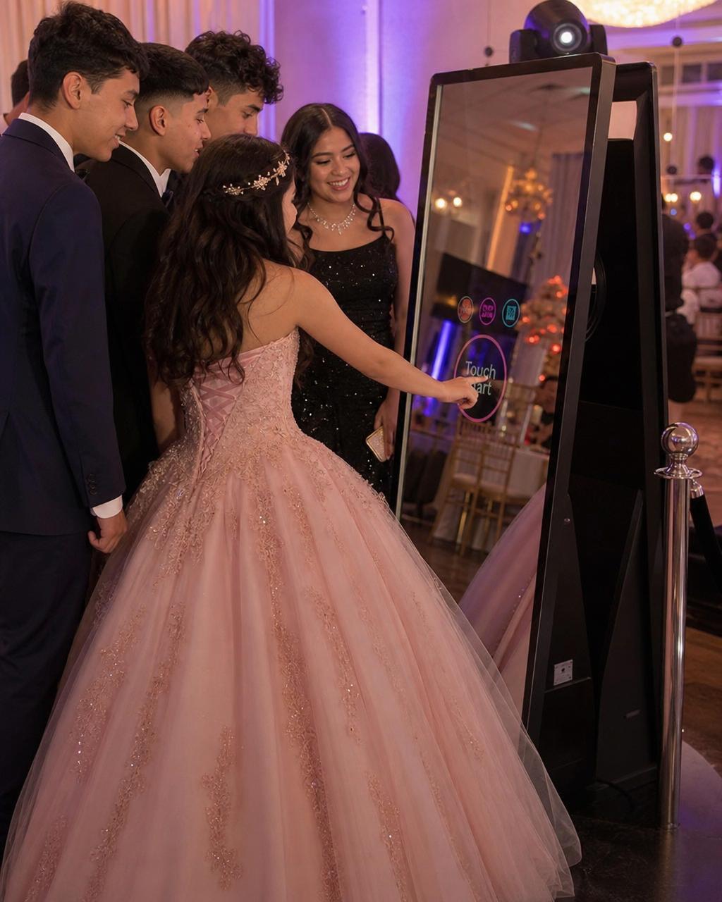 Magic Mirror photo booth with quinceañera guests
